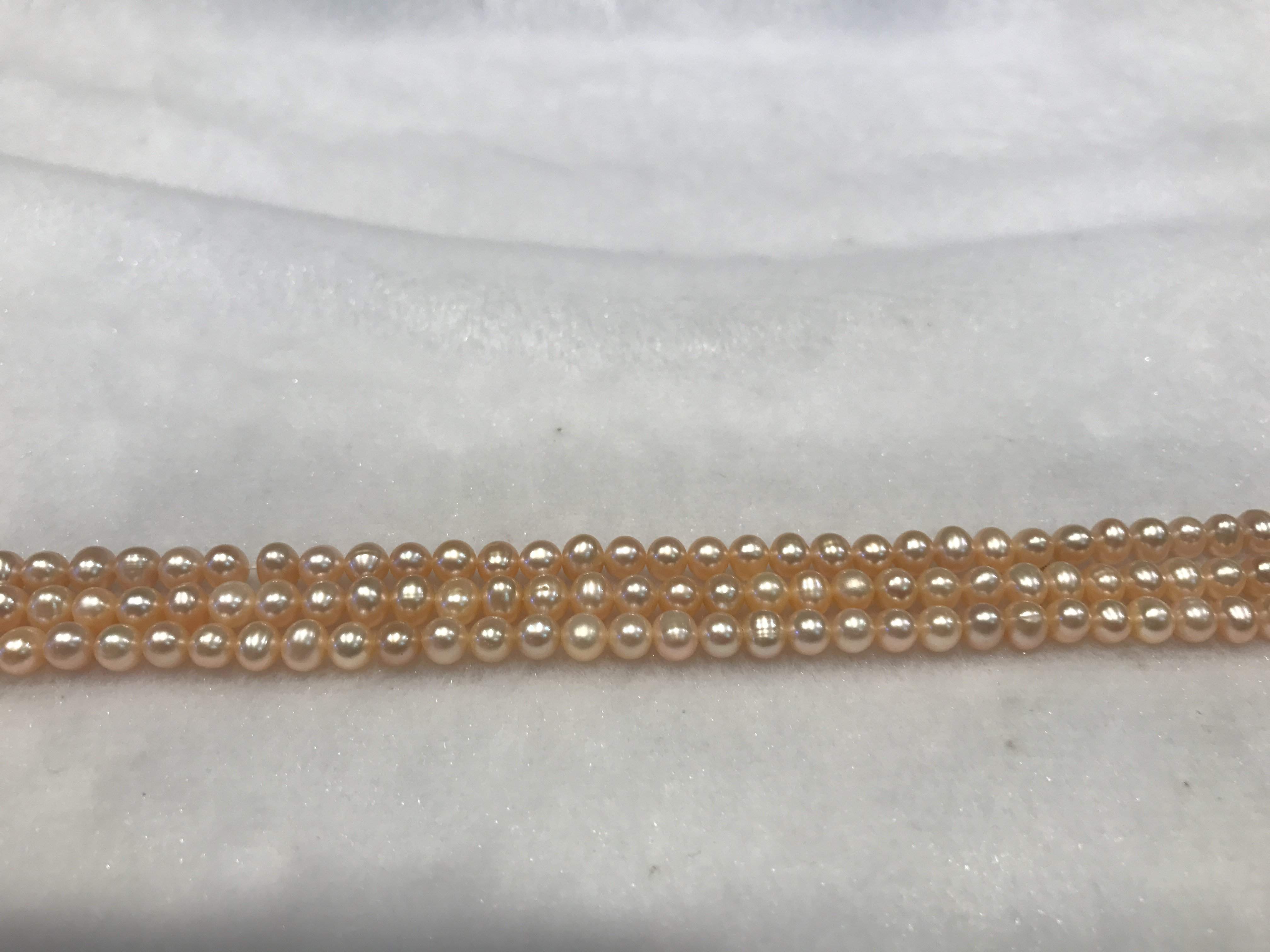 Strands Of Loose Pearls 5mm Off-Round Peach-Pearl Rack