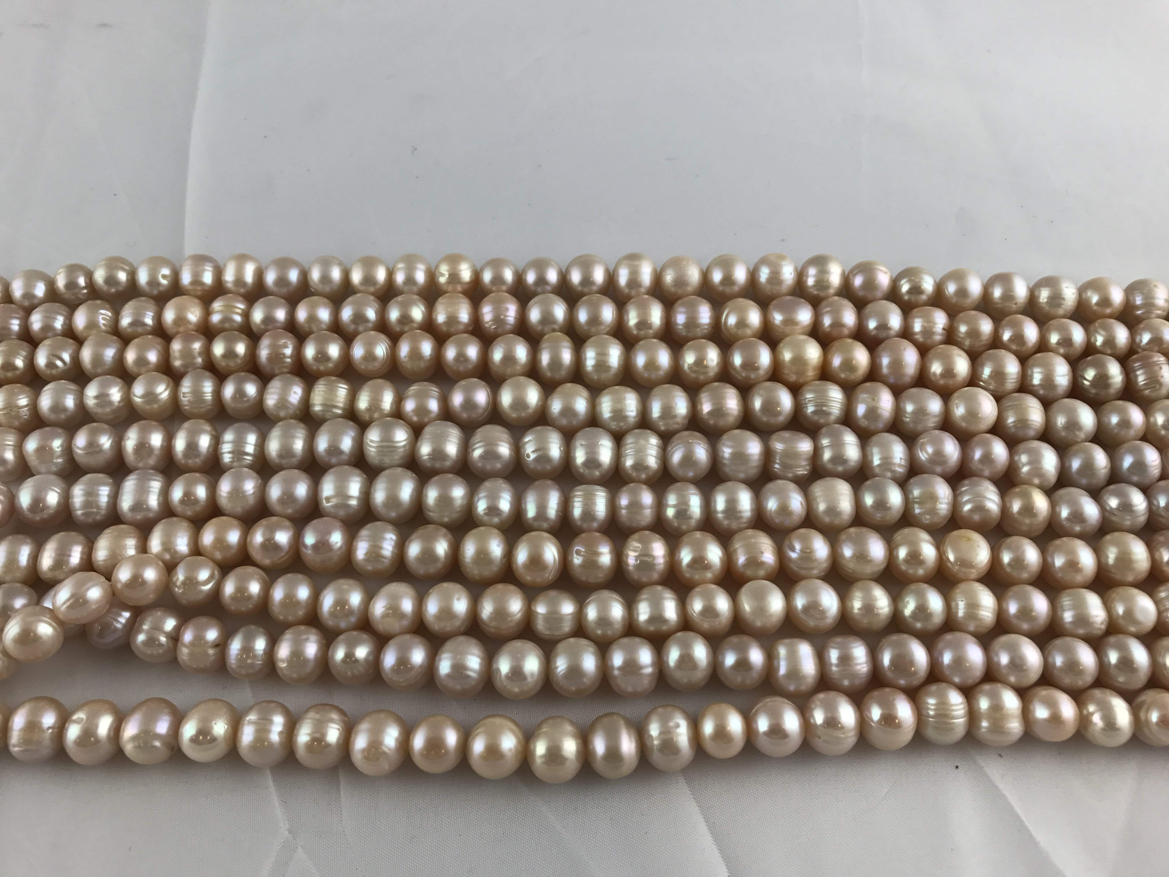 Strands Of Loose Pearls 11-12mm Off-Round Peach-Pearl Rack