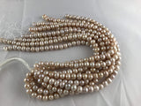 Strands Of Loose Pearls 11-12mm Off-Round Peach-Pearl Rack